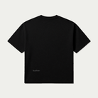 Essential T-shirt in black, back product shot with the boxy cut and small Buchan hem logo